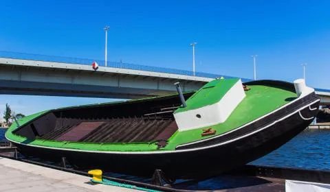 Tilted empty boat on docking ramp, Odra River, Poland Stock Photos