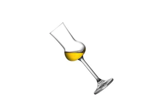 A tilted grappa glass Stock Photos