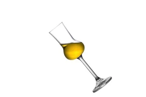 A tilted grappa glass Stock Photos