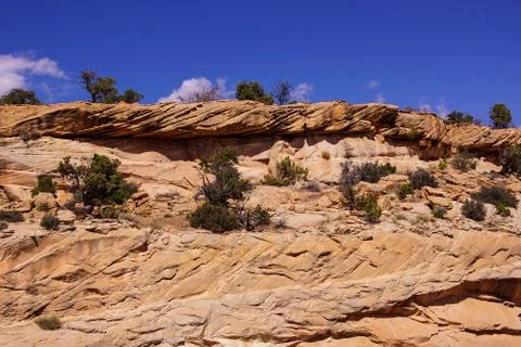 Tilted layers of sandstone cliffs Stock Photos