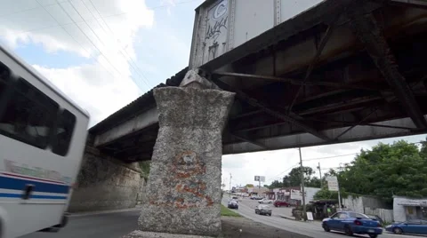 Tilted Shot of Two Way Traffic Under a Bridge With Graffiti on it 動画素材 50987721