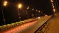 Tilted time-lapse driving cars, night city highway yellow lights HD Footage