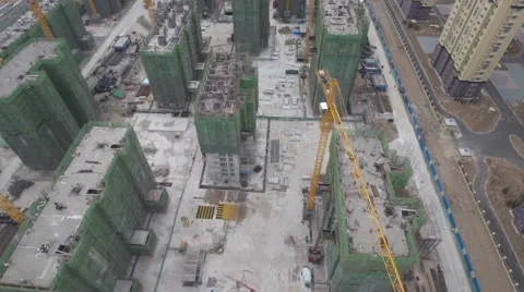 Tilting aerial drone shot of a large construction site in China Stock Footage