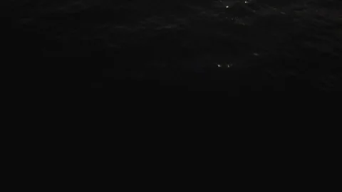 Tilting up aerial sunset shot over ocean Maui, Hawaii Stock Footage