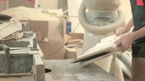 Tilting and panning shot of man working with maple wood Stock Footage 58304147