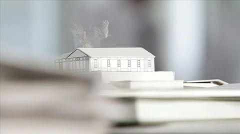 Tilting up from architectural scale model to portrait of three business 스톡 동영상 88407164