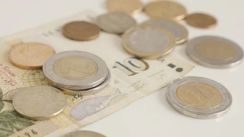 Tilting on Bulgarian lev stack of coins and paper money 4K video Stock Footage 120853325
