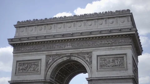 Tilting down from Arc de Triomphe tourists outside beautiful day Paris France Stock Footage 93814726
