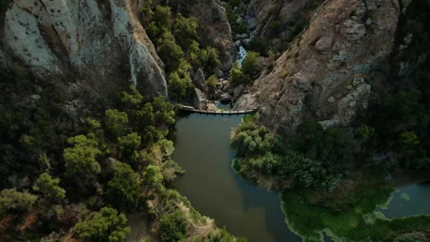 Tilting down over scenic dam between mountains Video stock 168214547