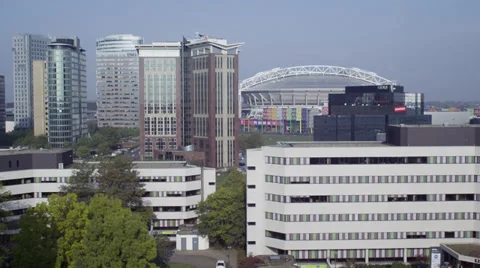 Tilting down shot from sky to office buildings Stock Footage 39769291