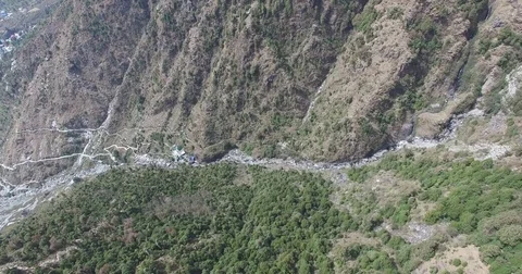 Tilting Down to Shrub-Covered Mountains Stock Footage 80953132