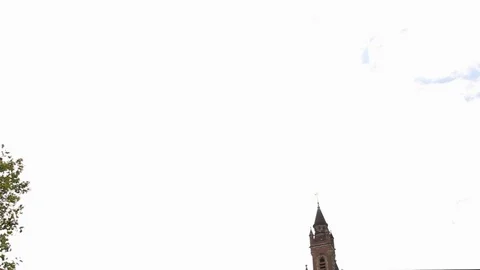 Tilting down from sky to Peace Palace in The Hague. It houses the Stock Footage 113570682