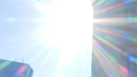 Tilting Down Through Rainbow Sun Flares to Crowded Downtown Boston Stock-Footage 92643921