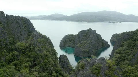 Tilting into a lagoon with abstract rock formations Stock Footage 102834976