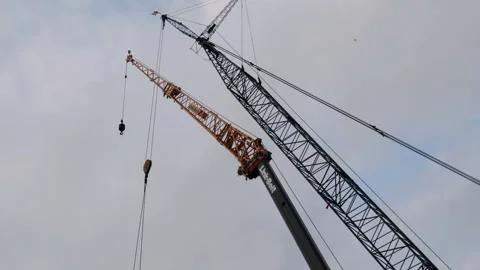 Tilting Up To Large Construction Site Cranes 4K 48FPS SLO-MO Stock Footage 265701503