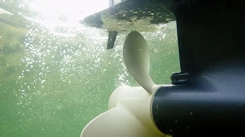 Tilting an outboard motor and engine starting. Underwater shot. Stock Footage 83863556