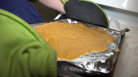 Tilting Pan To Spread Cake Batter Evenly Stock-Footage 57656244