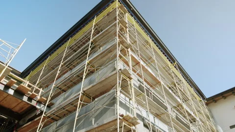 Tilting Up On Scaffolding Building Under Construction 4K 48FPS SLO-MO Stock Footage 266318376