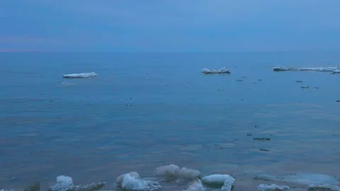 Tilting Shot of Remaining Spring Ice Chunks Along the Shore of Georgian Bay at Stock Footage 182066738