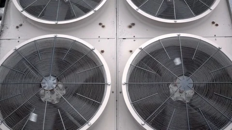 Tilting shot of some very large condenser fans Stock Footage 119994176