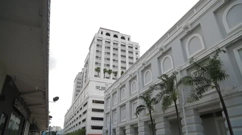 Tilting Shot from Top of Eastern &amp; Oriental Hotel building to Farquhar Street Stock Footage 48136685