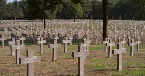 Tilting shot towards tombstone of unknownGerman soldier war grave Stock Footage 95114738
