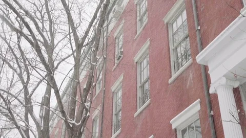 Tilting Snowy Washington Square Park Brick House in Winter Stock Footage