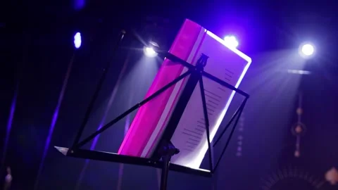 Tilting table-stand for music on stage with lighting before the performance Stock-Footage 303143157