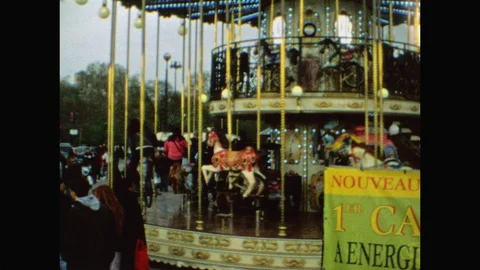 Tilt/pan from Eiffel Tower to Carousel/Merry-go-round in Paris-Super 8 Stock Footage 128576632