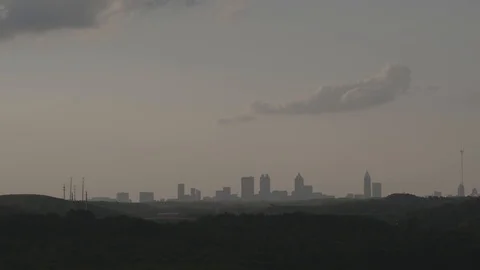 Tilt/Pan from painted clouds to skyline Video stock 92378079