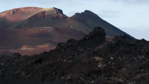 Timanfaya Volcanic Landscape Tracking Forward Long Lens Red Volcano 4K Video stock 101489473