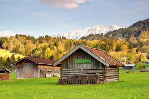 Timber barns under forests and mountains in Garmisch Germany Stock Photos