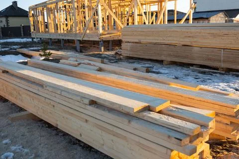Timber beams, planks and elements for house construction, site material sto.. Stock Photos