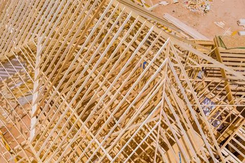 Timber frame beam framework house under construction with wooden trusses aerial Stock Photos