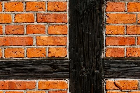 Timber frame brick wall with structural pattern and textured surface Stock Photos
