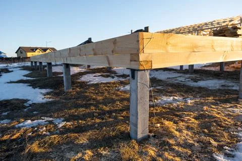 Timber frame construction on piles, substructure of base beams, site prep f.. Stock Photos