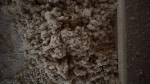 Timber frame house build, wood fibre loose fill insulation detail Video stock 327941124