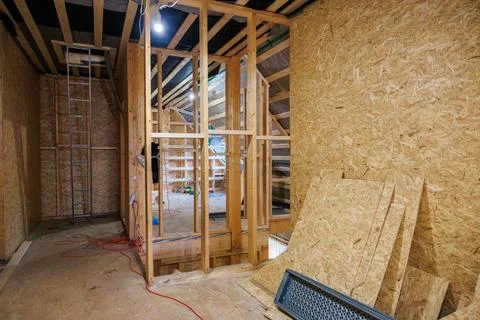 Timber frame loft under construction with exposed studs and rafters Photos