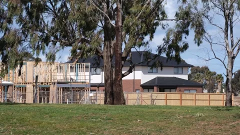 A timber-framed house under construction in suburban Melbourne Australia. Stock Footage 316797065