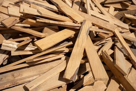 Timber piled on the ground for flooring, a random pile of wood. Stock Photos