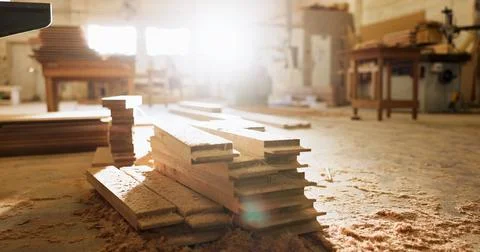 Timber, plank and carpentry in empty workshop for furniture manufacturing Stock Photos