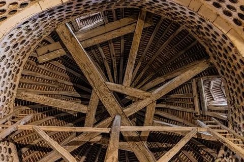 Timber roof framework seen from below inside a round stone structure at Cha.. Stock Photos