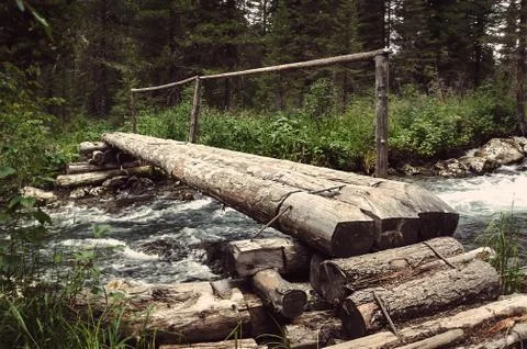 The timbered bridge passes through Stock Photos