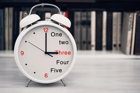 Time 3 three or 15 fifteen hours on a desk clock Stock Photos