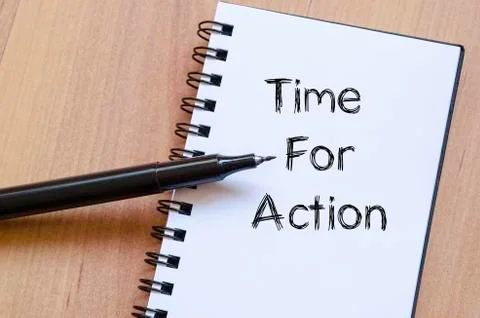 Time for action write on notebook Stock Photos