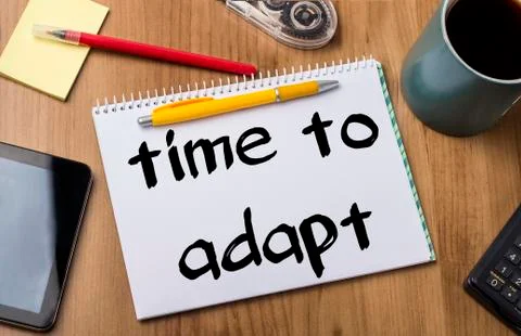 Time to adapt - Note Pad With Text On Wooden Table Stock Photos