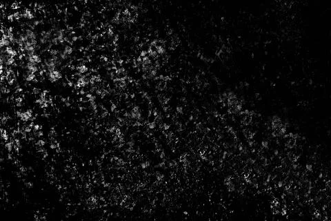 The time-aged textured rough surface of the wall is black and gray . Texture or Stock Photos