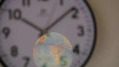 Time and space, a globe reflected on a wall clock. Видео 122316585