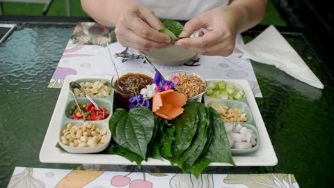 Time for Asian snack, a royal leaf wrap appetizer. Stock Footage 159421967