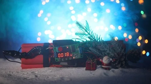 Time bomb (dynamite) on snow with holiday decor and santa Vídeos de archivo 121730634